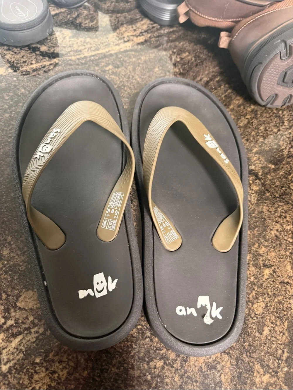 Sanuk Men's Tan Strap Black Footbed Flip-Flops